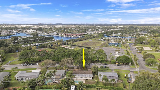 drone / aerial view featuring a residential view and a water view