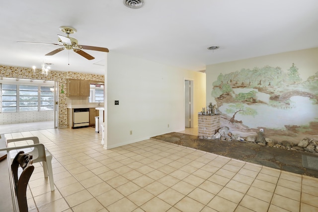 unfurnished living room featuring light tile patterned flooring, ceiling fan, and visible vents