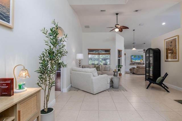 living room featuring light tile patterned floors and visible vents