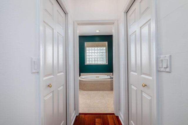 hallway with dark wood finished floors