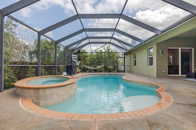 view of pool with a patio, a pool with connected hot tub, and a lanai