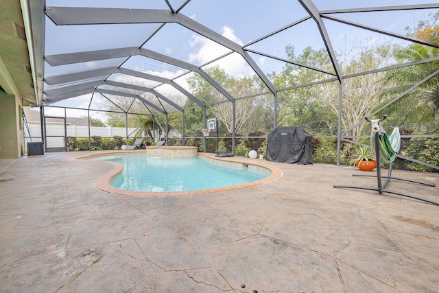 outdoor pool with a lanai, grilling area, a jacuzzi, and a patio