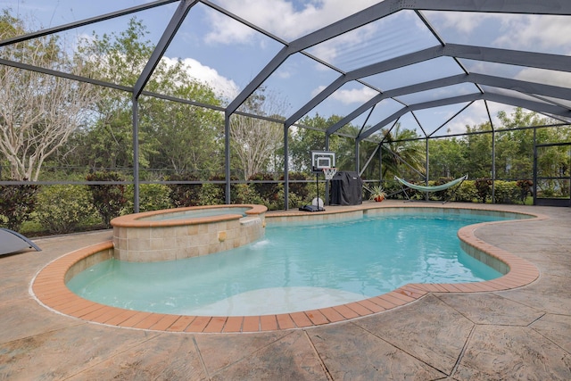 view of swimming pool featuring a lanai, a patio area, and a pool with connected hot tub