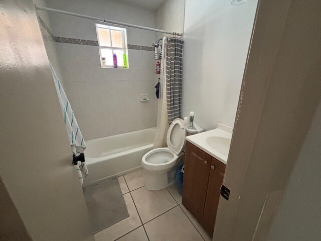 7430 Atlanta St, Hollywood, FL 33024 - bathroom featuring shower / tub combo with curtain, vanity, toilet, and tile patterned floors