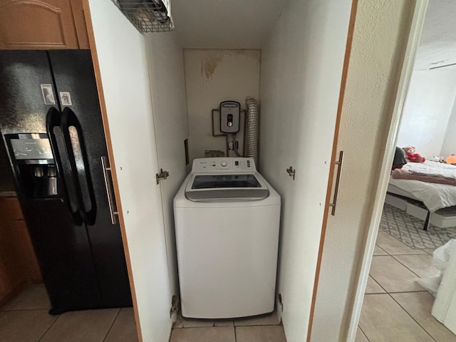 7430 Atlanta St, Hollywood, FL 33024 - laundry room featuring laundry area, light tile patterned flooring, and washer / dryer
