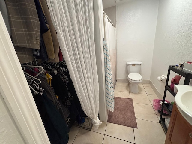 7430 Atlanta St, Hollywood, FL 33024 - full bathroom with toilet, vanity, baseboards, and tile patterned floors