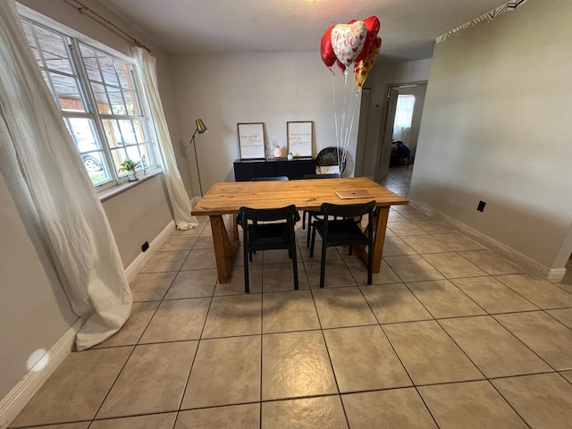 7430 Atlanta St, Hollywood, FL 33024 - dining room with light tile patterned flooring, a wealth of natural light, and baseboards