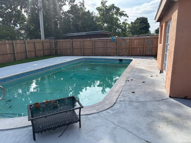 7430 Atlanta St, Hollywood, FL 33024 - view of swimming pool featuring a patio area, a fenced backyard, and a fenced in pool