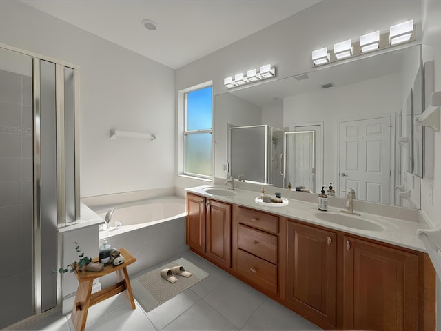 full bathroom featuring a garden tub, tile patterned flooring, a sink, and a stall shower