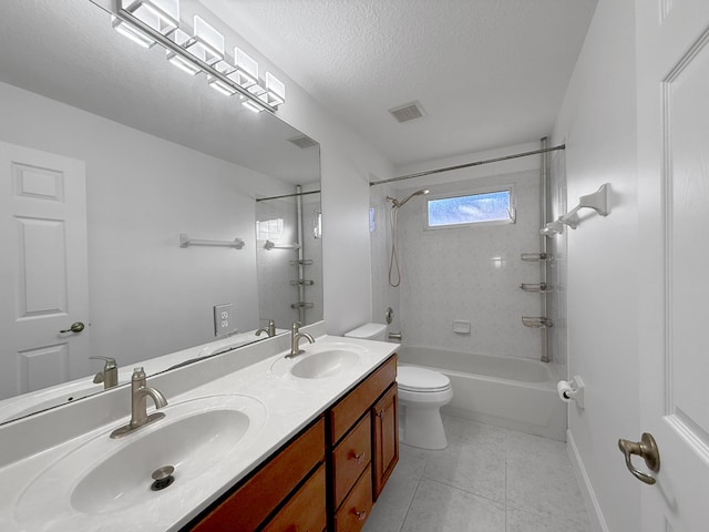 bathroom featuring shower / tub combination, a textured ceiling, a sink, and tile patterned floors