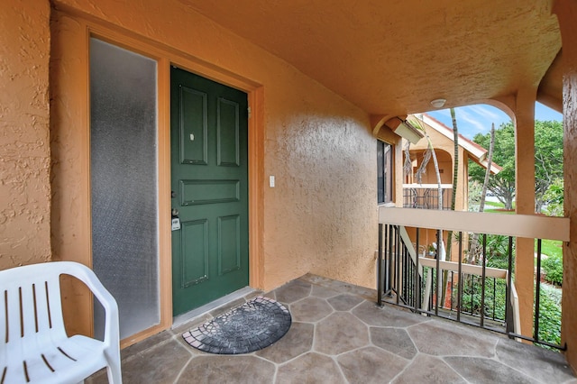 doorway to property with stucco siding