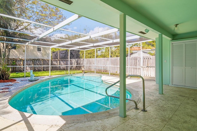 view of pool featuring a fenced in pool, glass enclosure, a patio area, and a fenced backyard