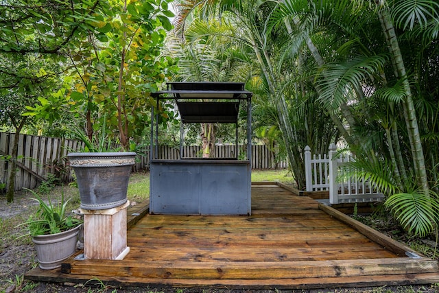 wooden terrace featuring fence private yard