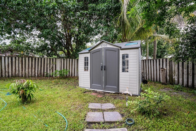 view of shed featuring a fenced backyard