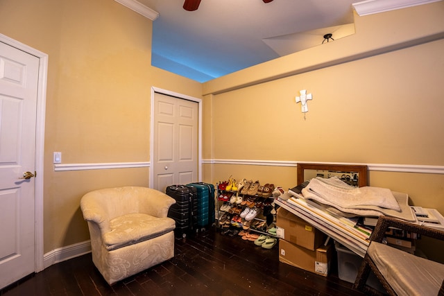 interior space featuring ceiling fan, baseboards, and dark wood-style flooring