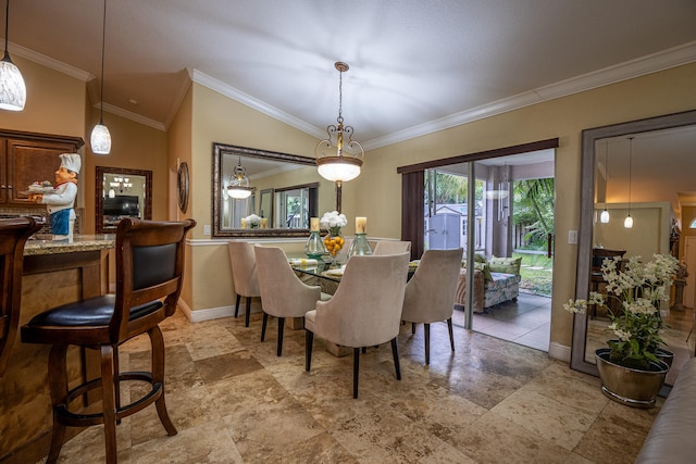 dining area featuring baseboards, vaulted ceiling, and ornamental molding