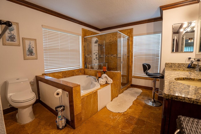 bathroom featuring double vanity, ornamental molding, a textured ceiling, a shower stall, and a bath