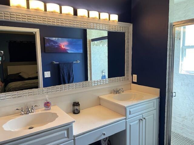 full bathroom with a stall shower and vanity