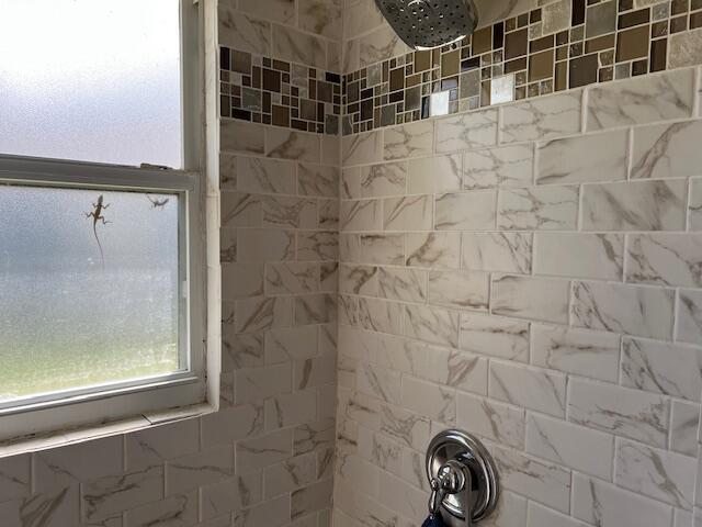 details with a tile shower