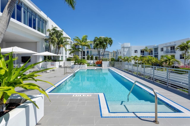 community pool featuring a patio area