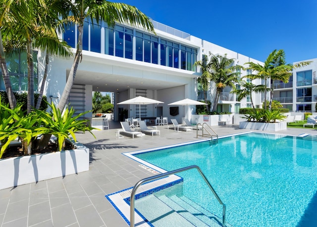 community pool with a patio area