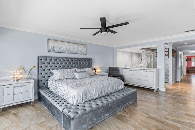 bedroom featuring visible vents, ornamental molding, a sink, ceiling fan, and baseboards