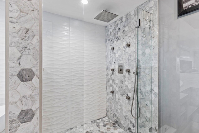 bathroom with a shower stall