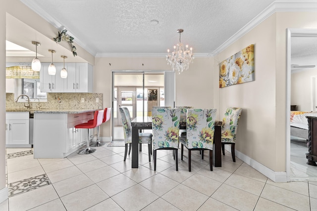 dining space featuring a notable chandelier, crown molding, light tile patterned floors, a textured ceiling, and baseboards