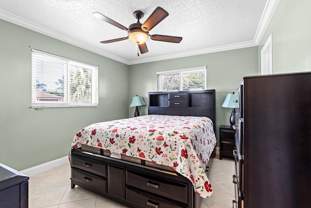 bedroom with refrigerator, light tile patterned floors, ornamental molding, a textured ceiling, and baseboards