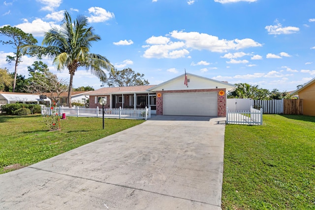 single story home with a fenced front yard, brick siding, concrete driveway, a front yard, and a garage