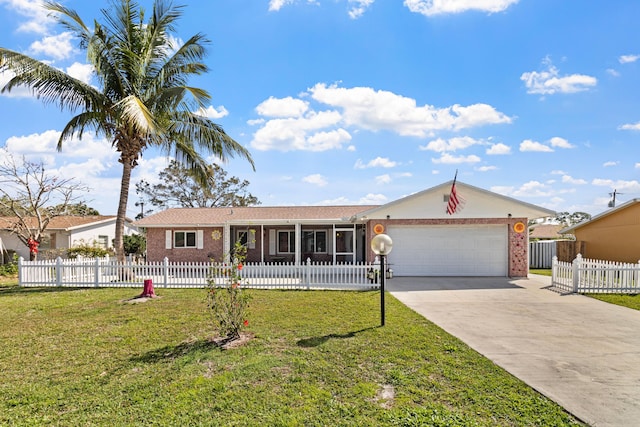 ranch-style home with a garage, brick siding, driveway, and a front yard