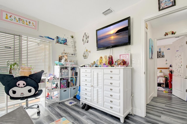 game room featuring wood finished floors, visible vents, and baseboards