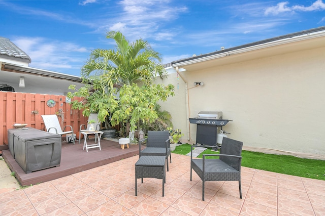 view of patio / terrace with area for grilling and fence