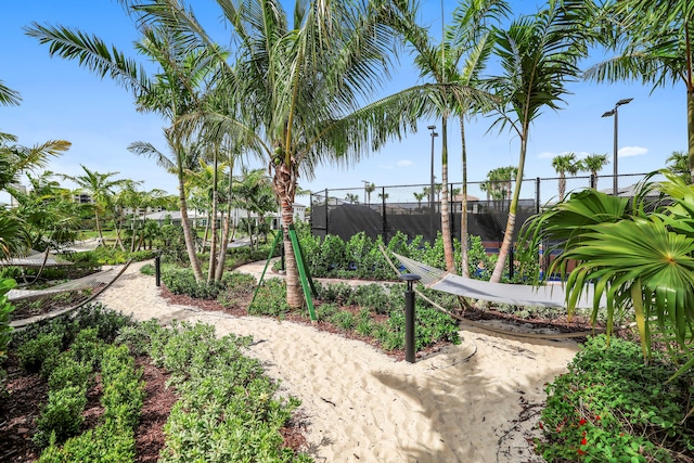 view of community featuring fence