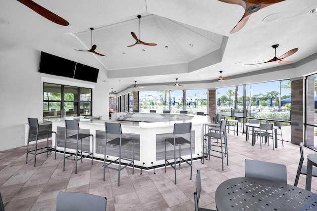 interior space featuring outdoor wet bar and ceiling fan