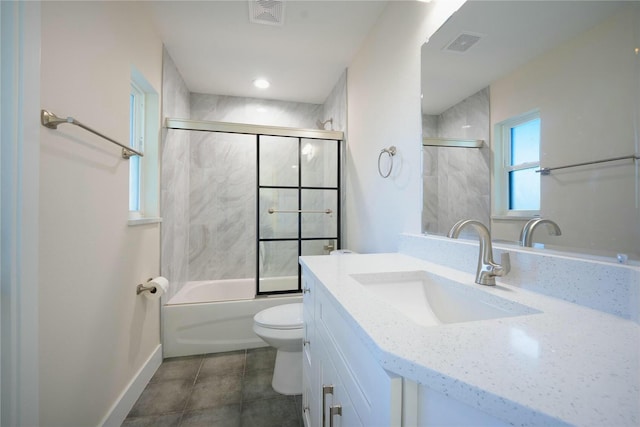 full bathroom featuring vanity, toilet, visible vents, and enclosed tub / shower combo