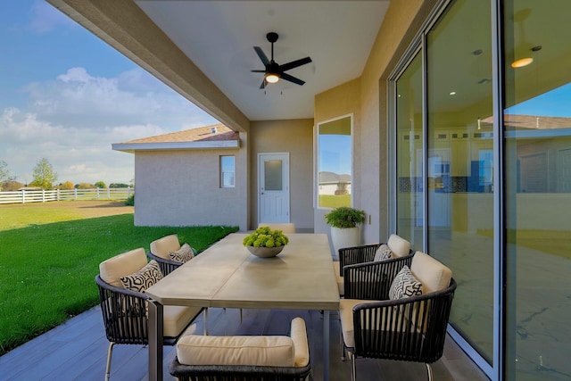 view of patio / terrace with outdoor dining space, a ceiling fan, and fence