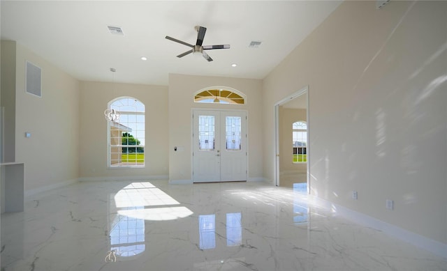 entryway featuring visible vents, plenty of natural light, and marble finish floor