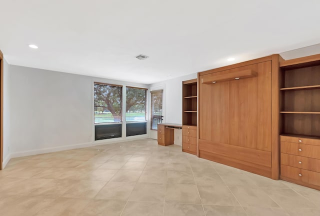 unfurnished living room featuring light tile patterned flooring, recessed lighting, visible vents, baseboards, and built in desk