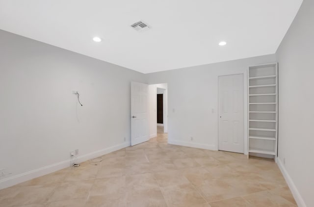 unfurnished bedroom featuring recessed lighting, a closet, visible vents, and baseboards