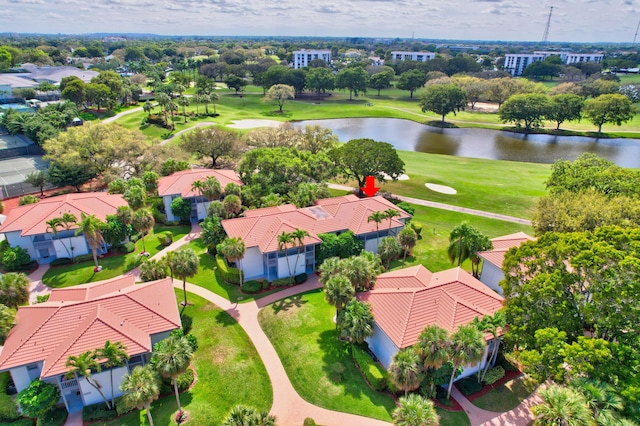 birds eye view of property with a residential view, view of golf course, and a water view