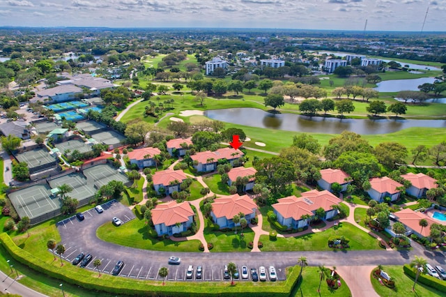 bird's eye view featuring a water view and a residential view