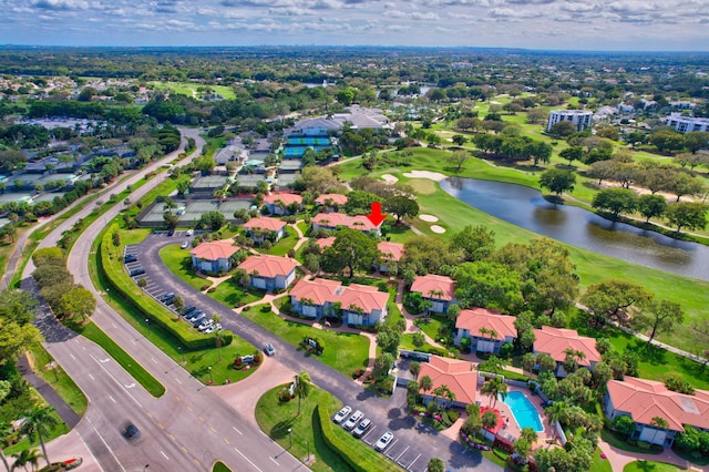 birds eye view of property with a water view and a residential view