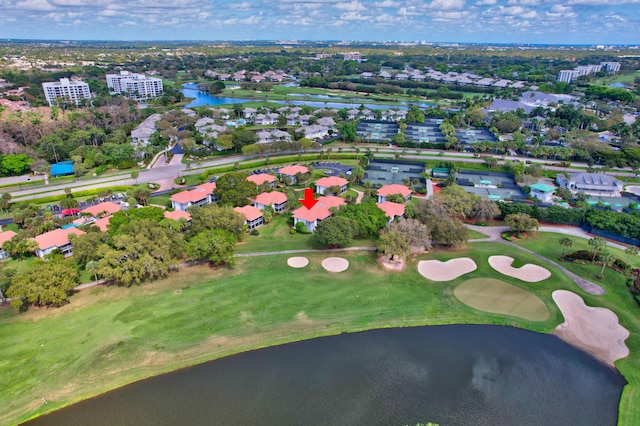 bird's eye view featuring view of golf course and a water view