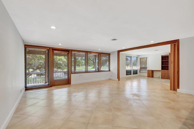 unfurnished room featuring recessed lighting, visible vents, baseboards, and light tile patterned floors