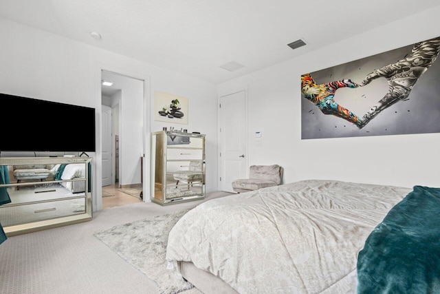 bedroom featuring carpet flooring and visible vents