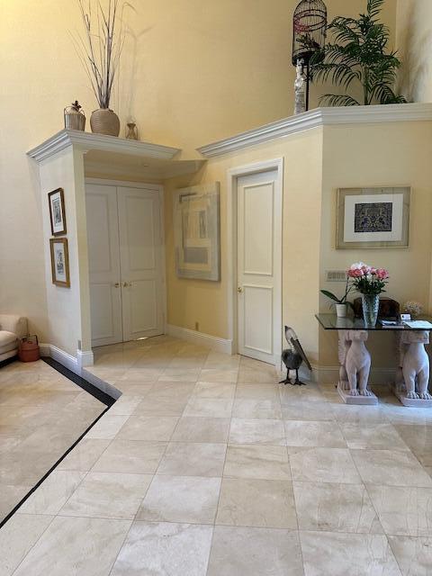 3271 Harrington Dr, Boca Raton, FL 33496 - foyer entrance featuring a high ceiling and baseboards