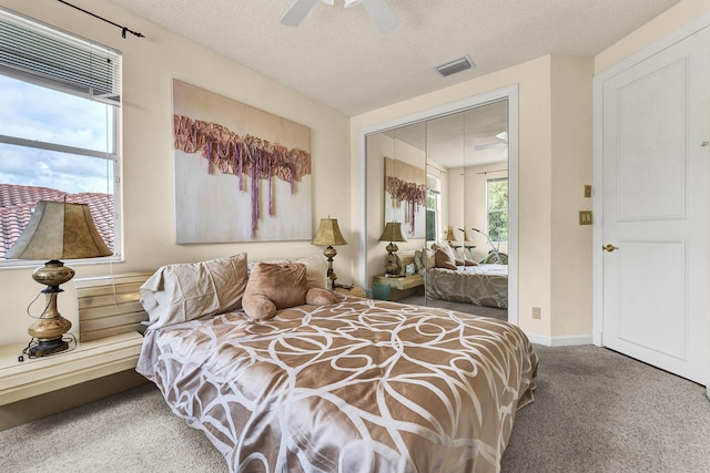 3271 Harrington Dr, Boca Raton, FL 33496 - carpeted bedroom featuring a ceiling fan, a textured ceiling, baseboards, and a closet