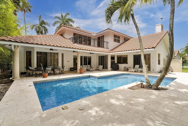 3271 Harrington Dr, Boca Raton, FL 33496 - rear view of property featuring a ceiling fan, an outdoor living space, stucco siding, and an outdoor pool
