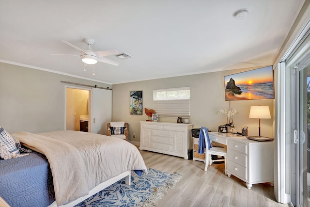 bedroom with crown molding, visible vents, a barn door, a ceiling fan, and light wood-type flooring